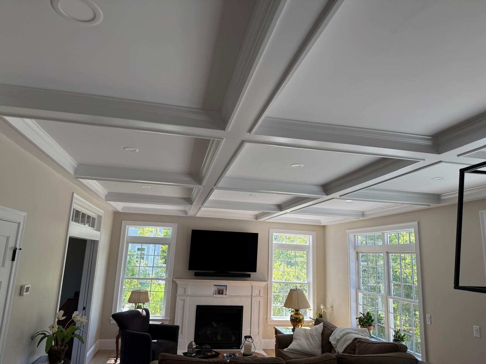 Coffered ceiling with custom trim in a New England home by Miranda Finish Carpentry